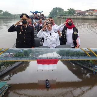 Camat Senapelan Jadi Pembina Upacara Pengibaran Bendera Ukuran Raksasa 20x10 Meter di Bawah Jembatan Siak III